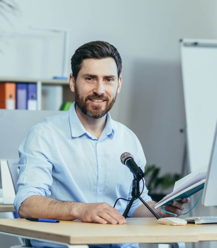 portrait-of-a-businessman-coach-a-man-looks-at-the-camera-and-smiles.jpg